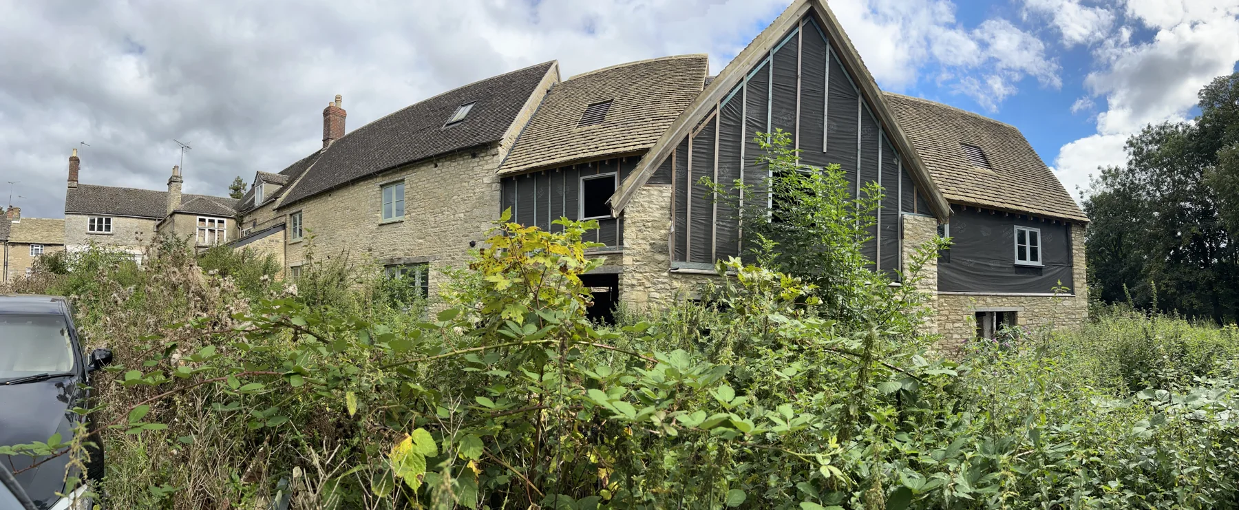 Traditional building with timber clad extension