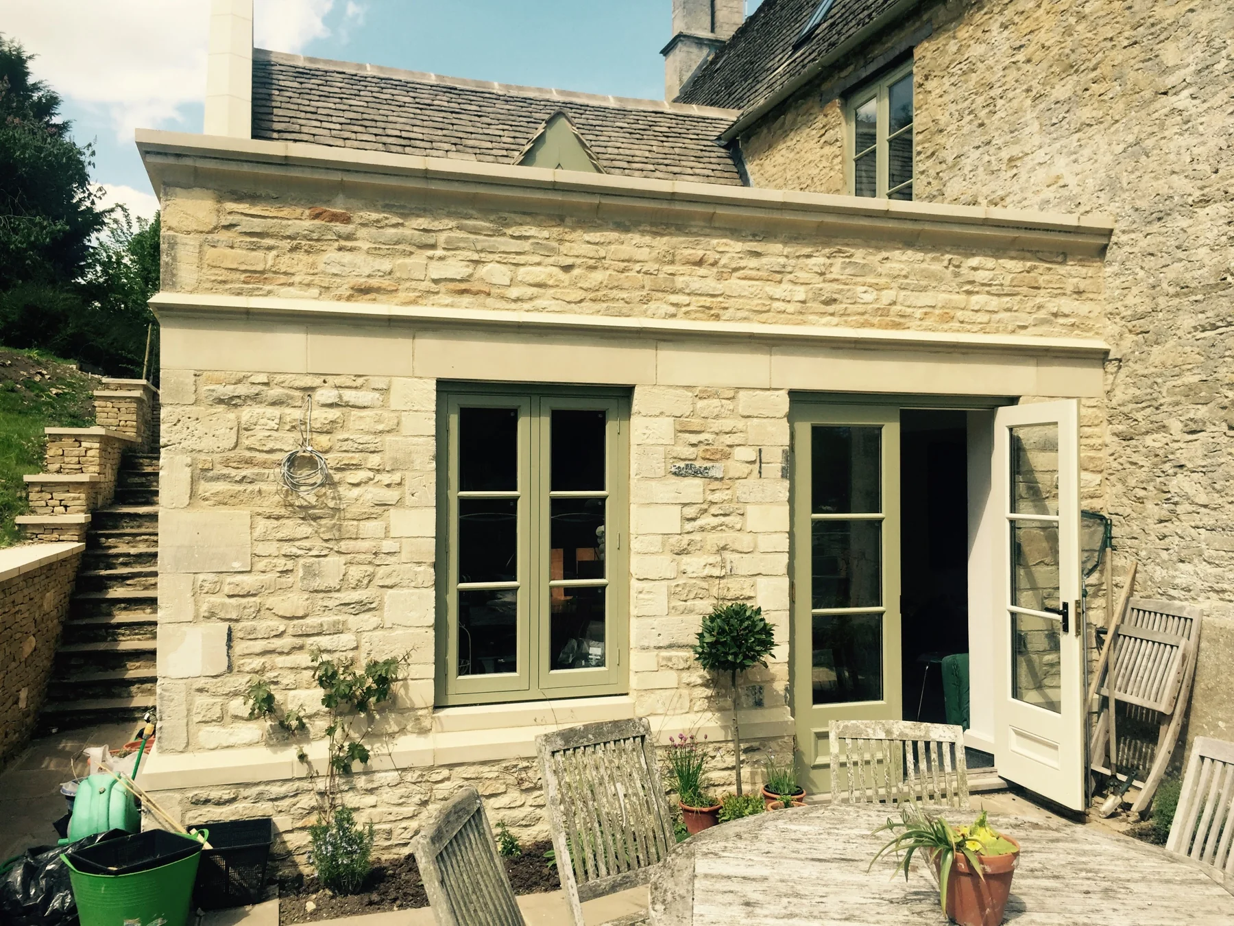 Stone extension with tall glazed openings